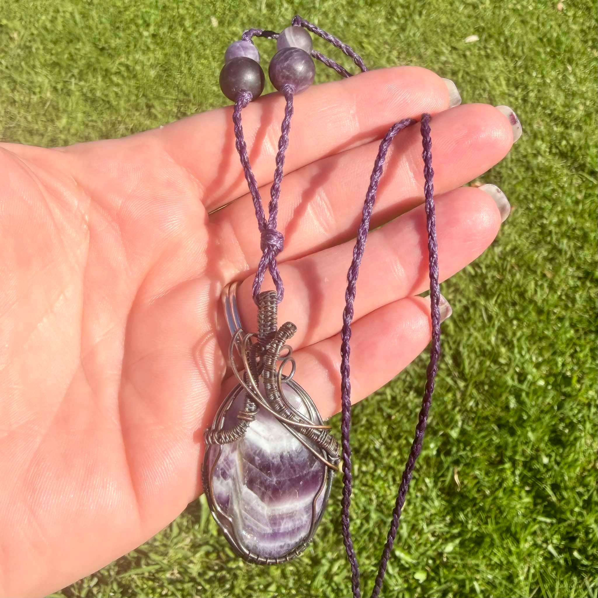 Nightshade Elixir is a handmade chevron amethyst necklace from New Zealand, a Luna Magick collab piece for intuition, clarity and positive energy.