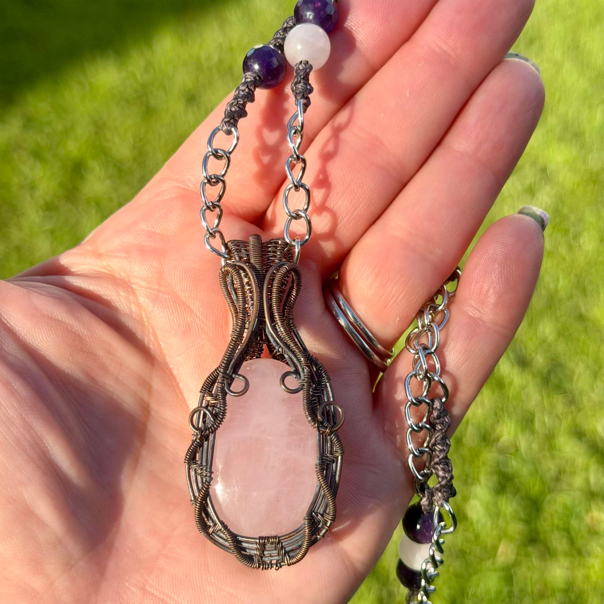 Freyja's Heart is a handmade rose quartz and amethyst pendant from New Zealand, a Luna Magick collab piece for love, healing and inner peace.
